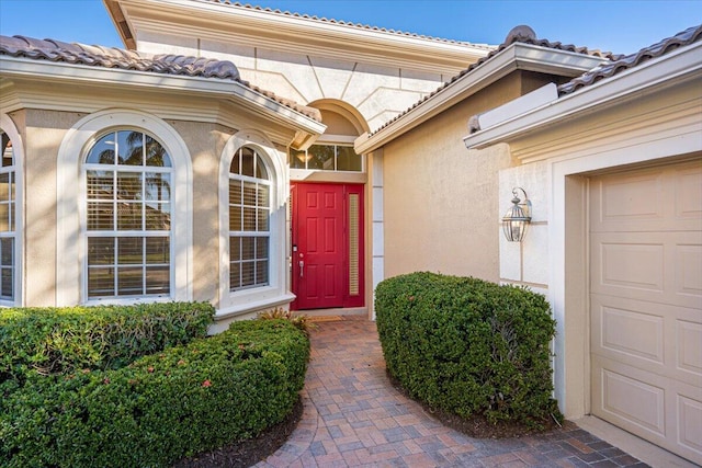 doorway to property featuring a garage