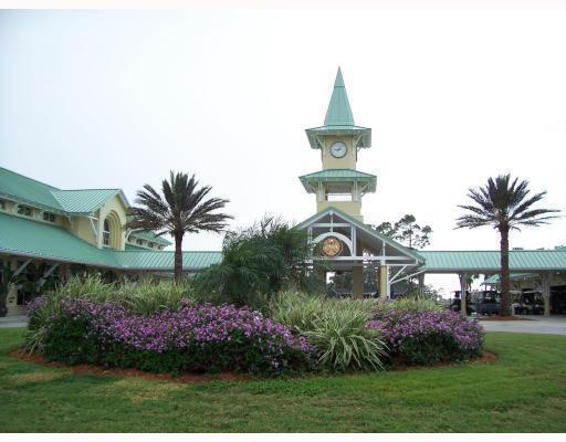 view of property's community with a yard