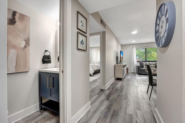 hallway featuring wood-type flooring