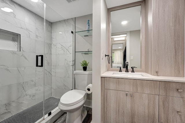 bathroom featuring hardwood / wood-style floors, an enclosed shower, vanity, and toilet