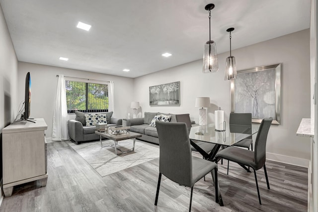 dining space featuring hardwood / wood-style flooring