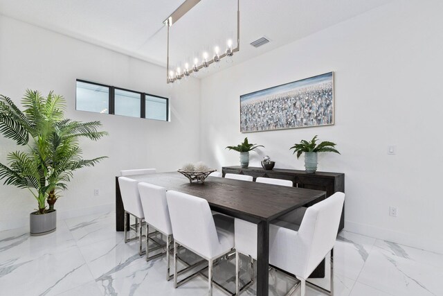 13689 Artisan Cir, Palm Beach Gardens, FL 33418 - dining room featuring baseboards, marble finish floor, and visible vents