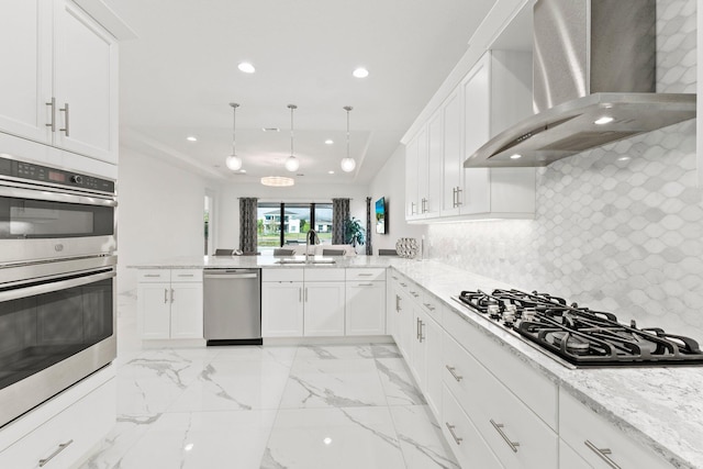 13689 Artisan Cir, Palm Beach Gardens, FL 33418 - kitchen with a sink, wall chimney range hood, recessed lighting, white cabinets, and appliances with stainless steel finishes
