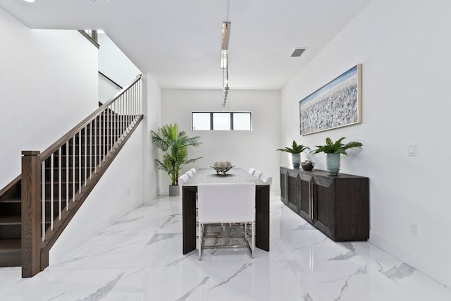 dining space featuring a textured ceiling