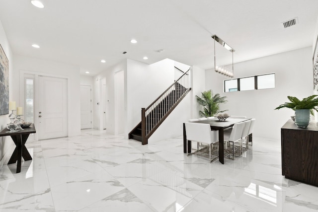 dining space with a chandelier