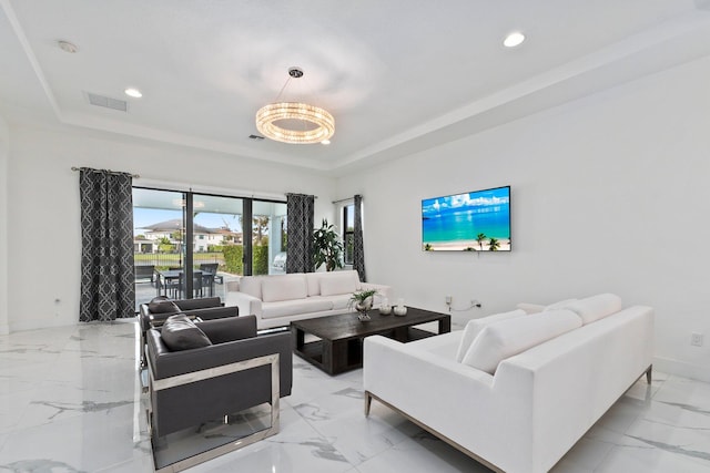 living room featuring a tray ceiling