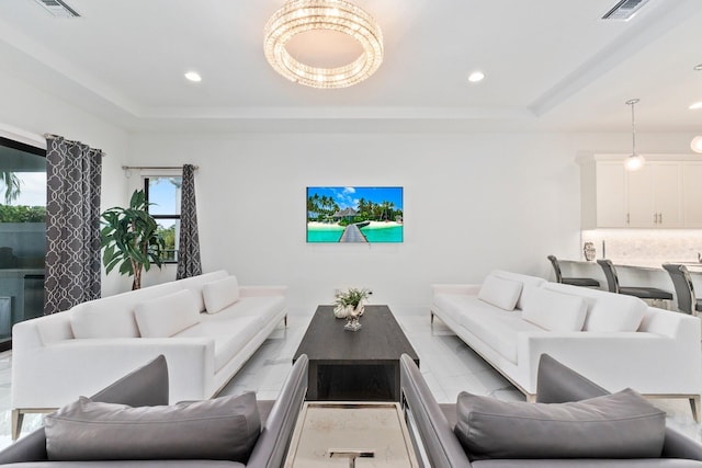 living room with a tray ceiling