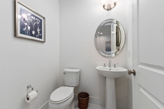 bathroom featuring toilet and sink