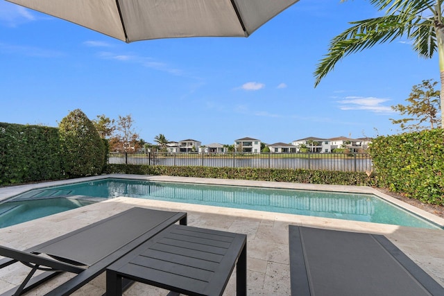13689 Artisan Cir, Palm Beach Gardens, FL 33418 - view of swimming pool featuring a patio, a residential view, and a fenced backyard