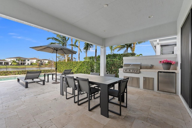 13689 Artisan Cir, Palm Beach Gardens, FL 33418 - view of patio with area for grilling, outdoor dining area, and fence
