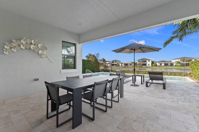 13689 Artisan Cir, Palm Beach Gardens, FL 33418 - view of patio / terrace with fence, a fenced in pool, outdoor dining space, and a residential view