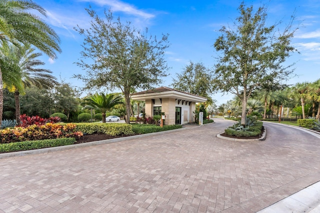 13689 Artisan Cir, Palm Beach Gardens, FL 33418 - view of front of house featuring curved driveway
