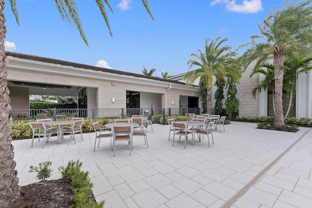 13689 Artisan Cir, Palm Beach Gardens, FL 33418 - view of patio / terrace featuring outdoor dining space and fence