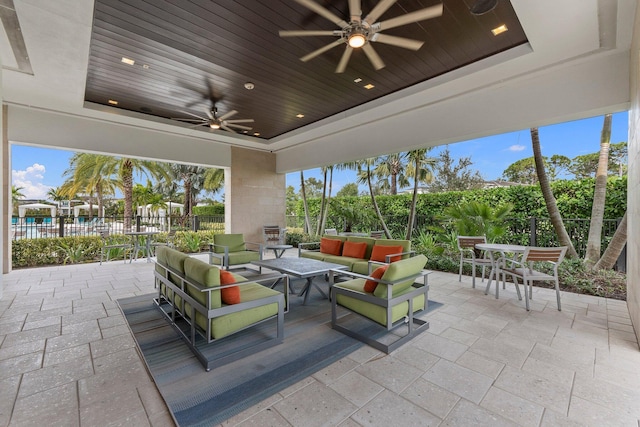 13689 Artisan Cir, Palm Beach Gardens, FL 33418 - view of patio / terrace featuring ceiling fan, an outdoor hangout area, outdoor dining space, and fence