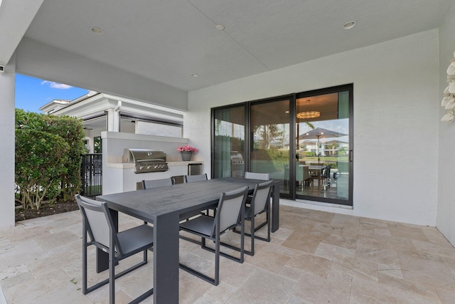 view of patio / terrace with area for grilling and a grill