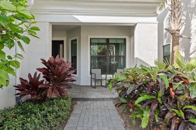 13689 Artisan Cir, Palm Beach Gardens, FL 33418 - view of exterior entry with covered porch