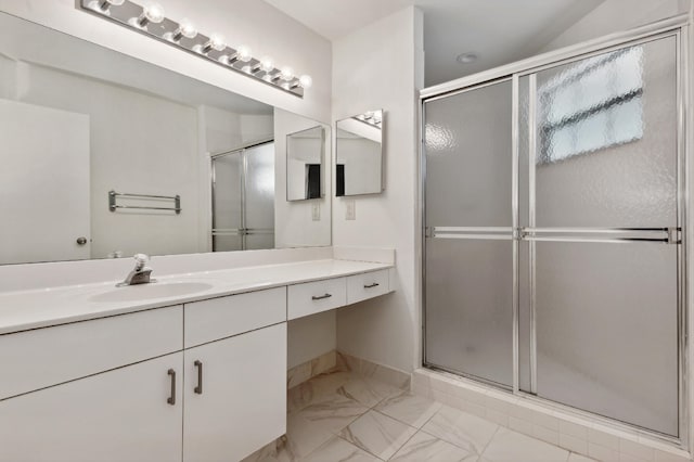 bathroom with vanity and an enclosed shower