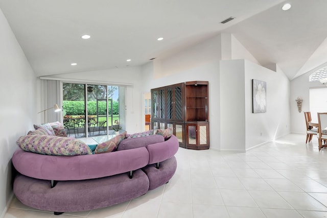 living room featuring light tile patterned flooring and lofted ceiling