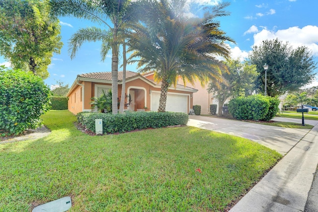 view of front facade with a garage and a front yard