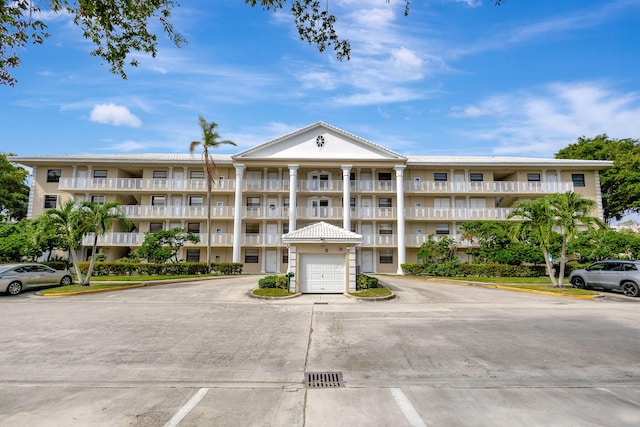 3507 Village Blvd Unit 305, West Palm Beach, FL 33409 - view of apartment building / complex with uncovered parking