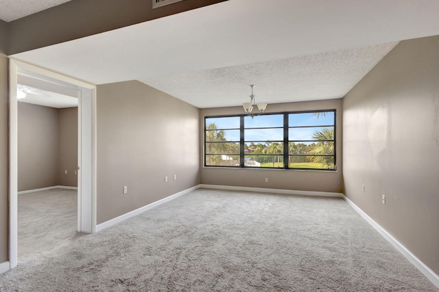 3507 Village Blvd Unit 305, West Palm Beach, FL 33409 - carpeted spare room featuring a chandelier and a textured ceiling