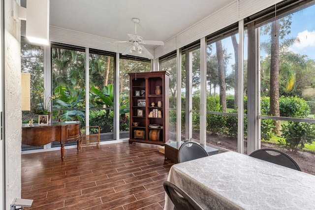 sunroom / solarium featuring ceiling fan