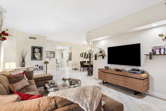 living room featuring light wood-type flooring and an inviting chandelier