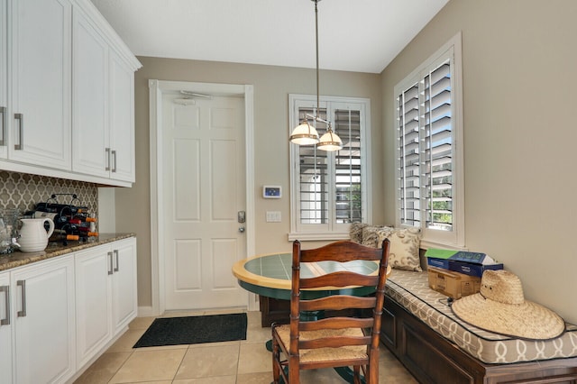 dining room featuring light tile patterned flooring