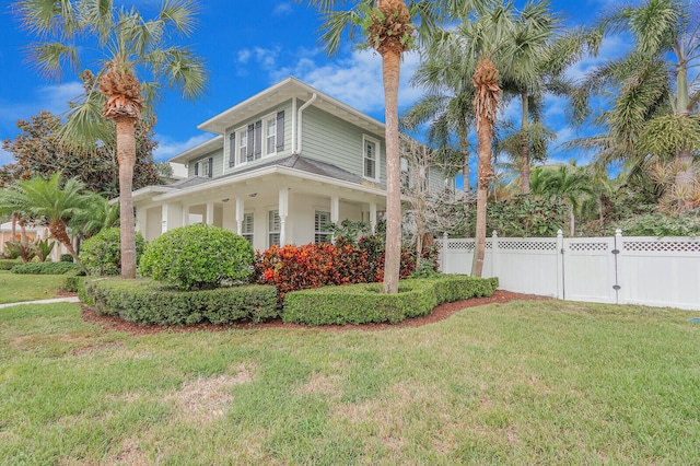 view of side of property with a lawn