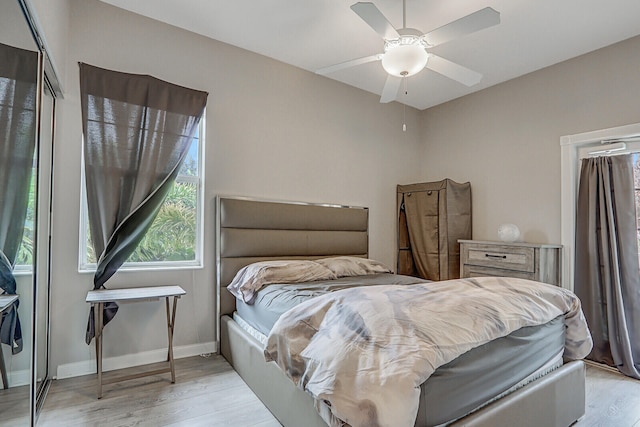 bedroom with light wood-type flooring and ceiling fan