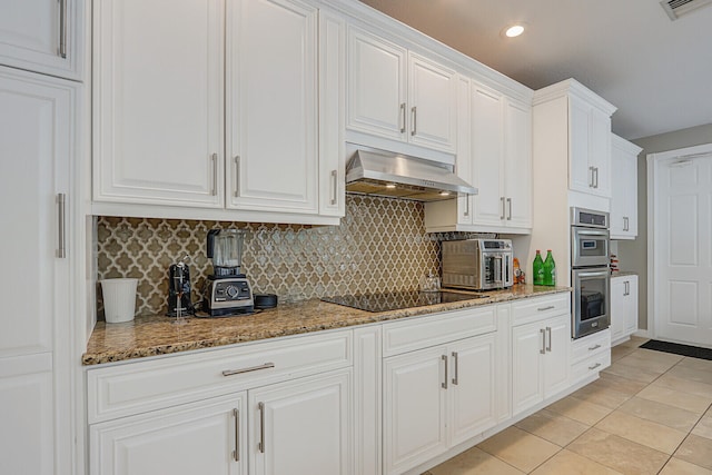 kitchen with extractor fan, light tile patterned floors, white cabinets, black electric cooktop, and double oven