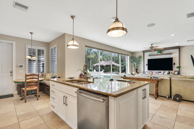 kitchen with white cabinetry, stainless steel dishwasher, hanging light fixtures, and sink