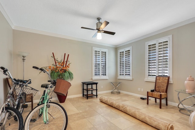 living area with ornamental molding, light tile patterned flooring, and ceiling fan