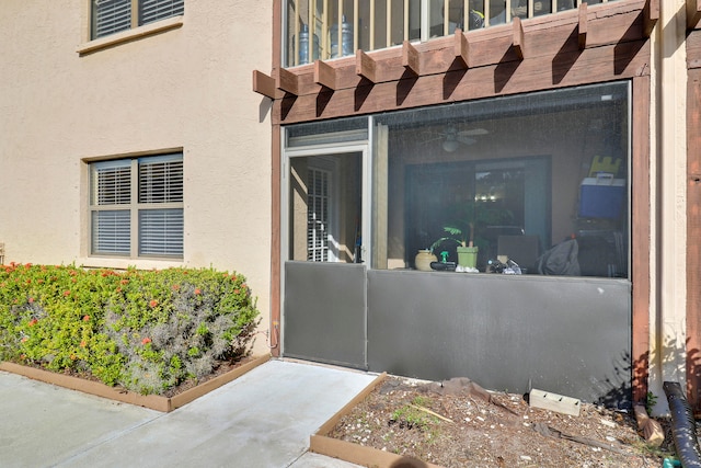 entrance to property featuring a patio area