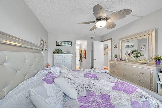 bedroom featuring a textured ceiling and ceiling fan