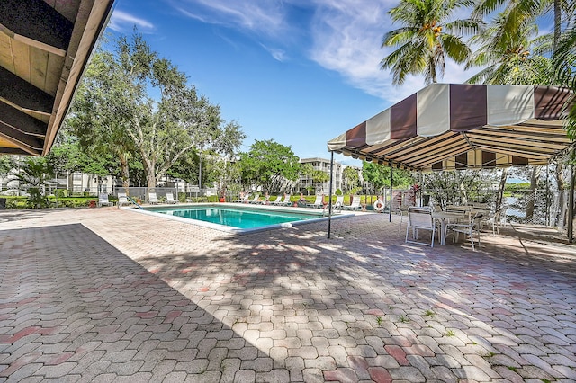 view of swimming pool featuring a patio area