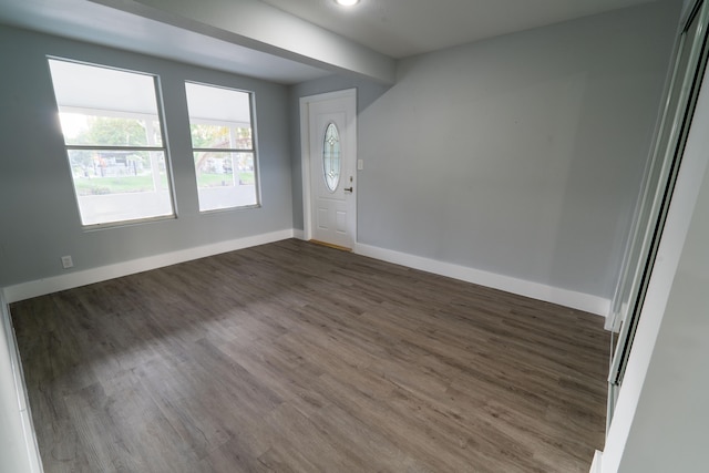 empty room featuring dark hardwood / wood-style flooring