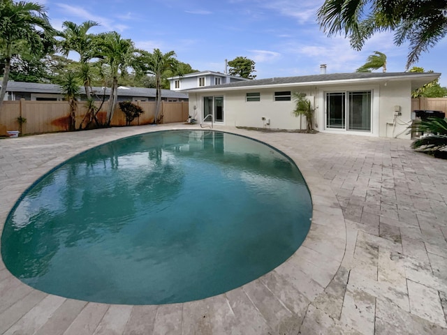 232 NW 25th St, Wilton Manors, FL 33311 - view of pool with a patio area and a fenced backyard