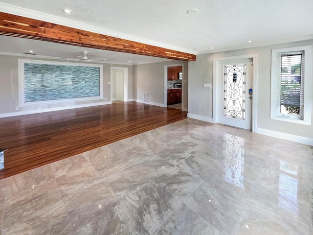 unfurnished living room featuring ceiling fan, ornamental molding, and light hardwood / wood-style flooring