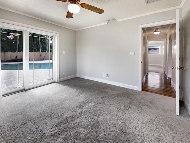 232 NW 25th St, Wilton Manors, FL 33311 - carpeted empty room with baseboards, ceiling fan, and ornamental molding