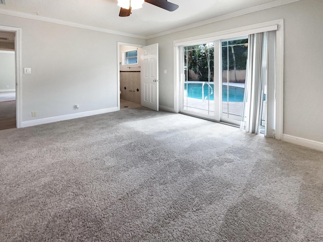 232 NW 25th St, Wilton Manors, FL 33311 - carpeted empty room with ornamental molding, a ceiling fan, and baseboards