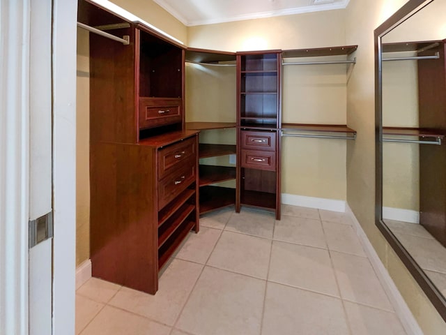 walk in closet featuring light tile patterned floors