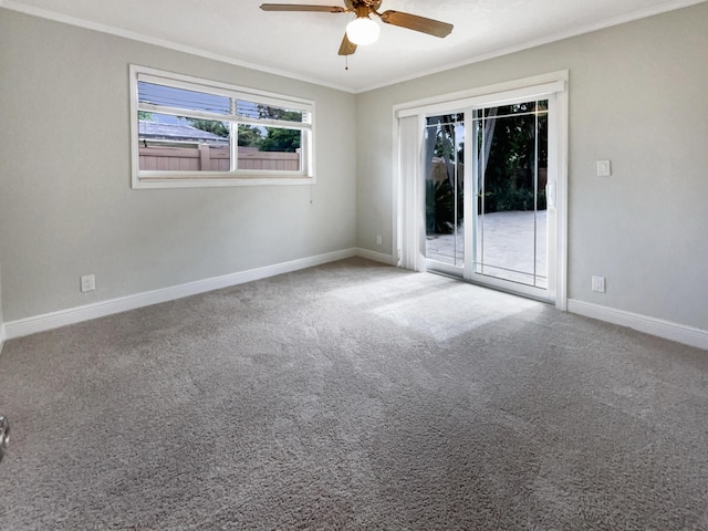 232 NW 25th St, Wilton Manors, FL 33311 - carpeted empty room with ceiling fan, ornamental molding, and baseboards