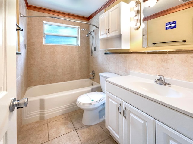 full bathroom featuring vanity, tiled shower / bath, tile patterned flooring, and crown molding