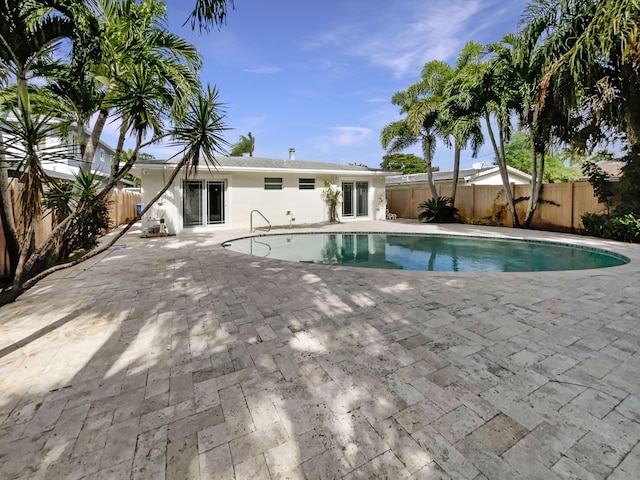 232 NW 25th St, Wilton Manors, FL 33311 - view of swimming pool with a patio area and a fenced backyard