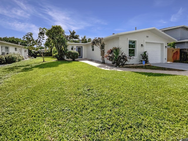 232 NW 25th St, Wilton Manors, FL 33311 - view of front facade featuring a garage, driveway, and brick siding