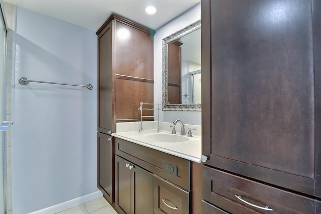 bathroom featuring tile patterned floors and vanity