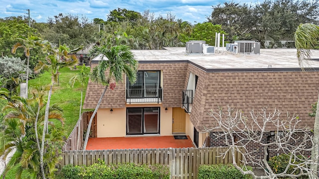 back of property with a patio and cooling unit