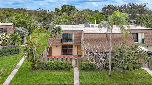 back of house featuring a yard