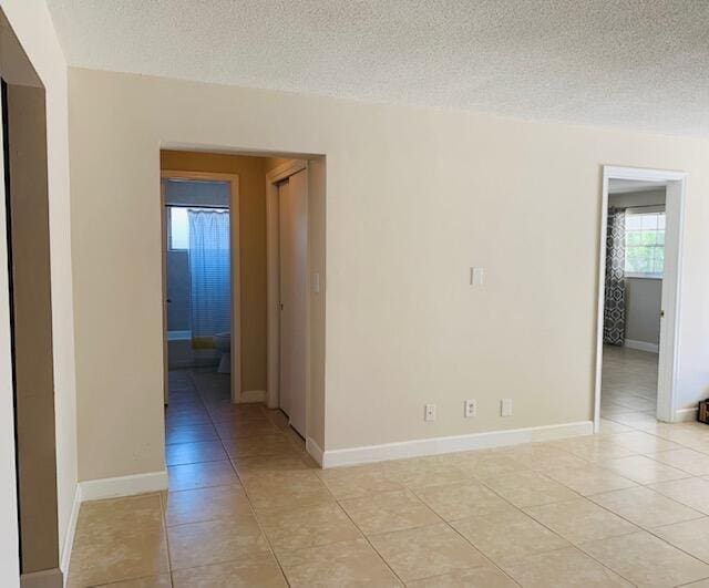 2727-29 NE 30th Ave, Lighthouse Point, FL 33064 - unfurnished room featuring light tile patterned floors and a textured ceiling